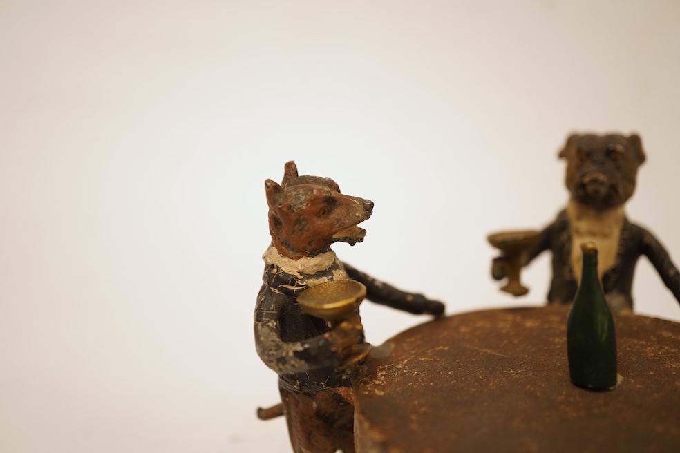 A cold painted spelter miniature ‘dog’ group, 6.5cm